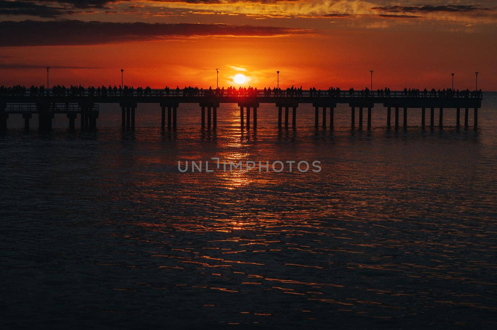 sunset on the pier in Palanga, Baltic sea.