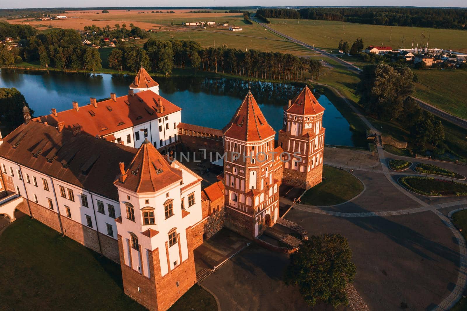 Mir castle with spires near the lake top view in Belarus near the city of Mir by Lobachad