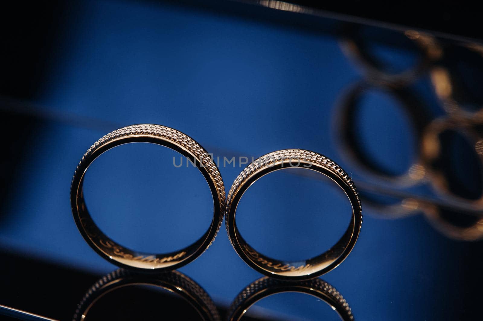 Close-up of two gold wedding rings for a wedding.