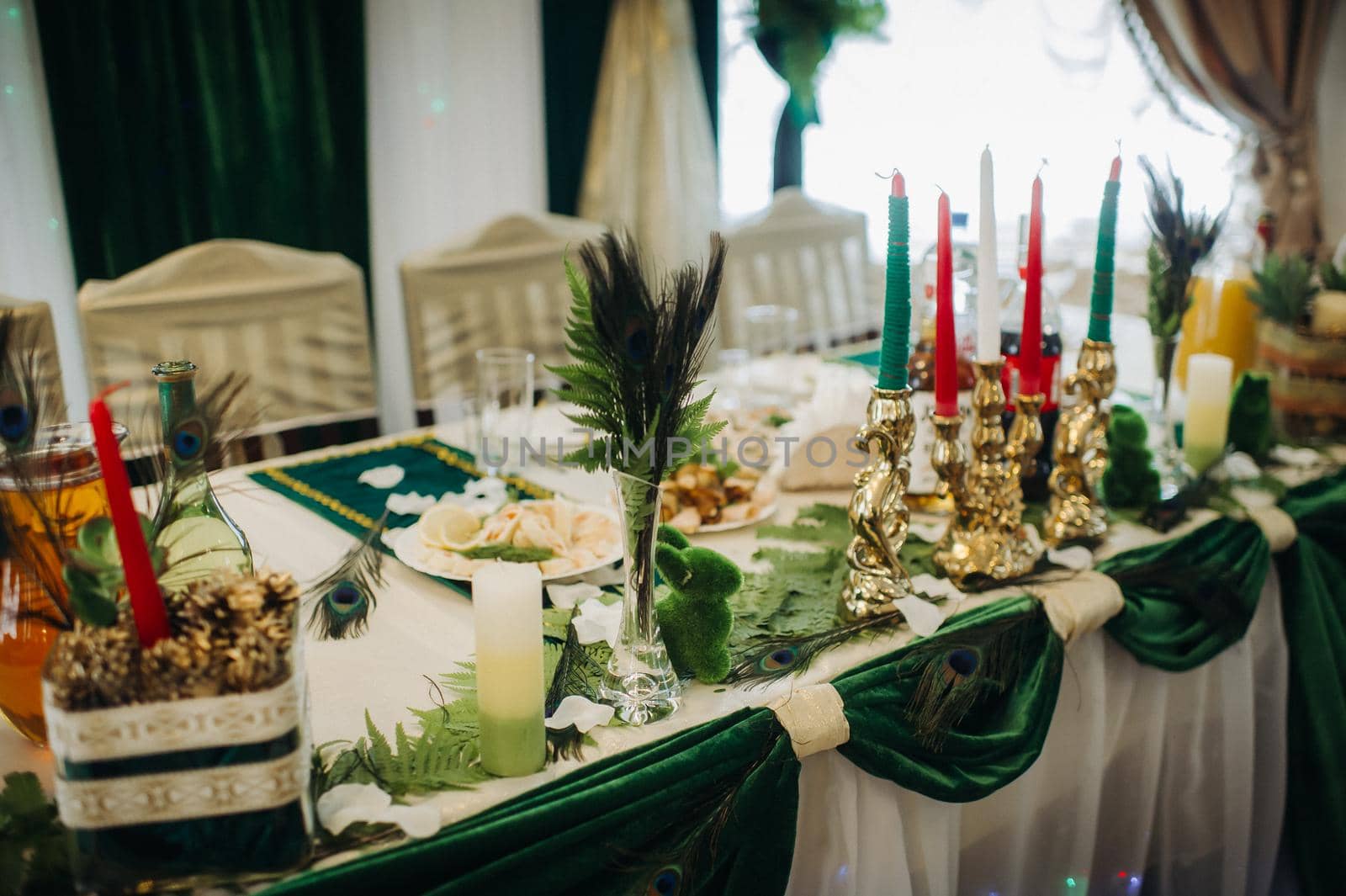 wedding table decoration with flowers on the table in green style, dinner table decor.