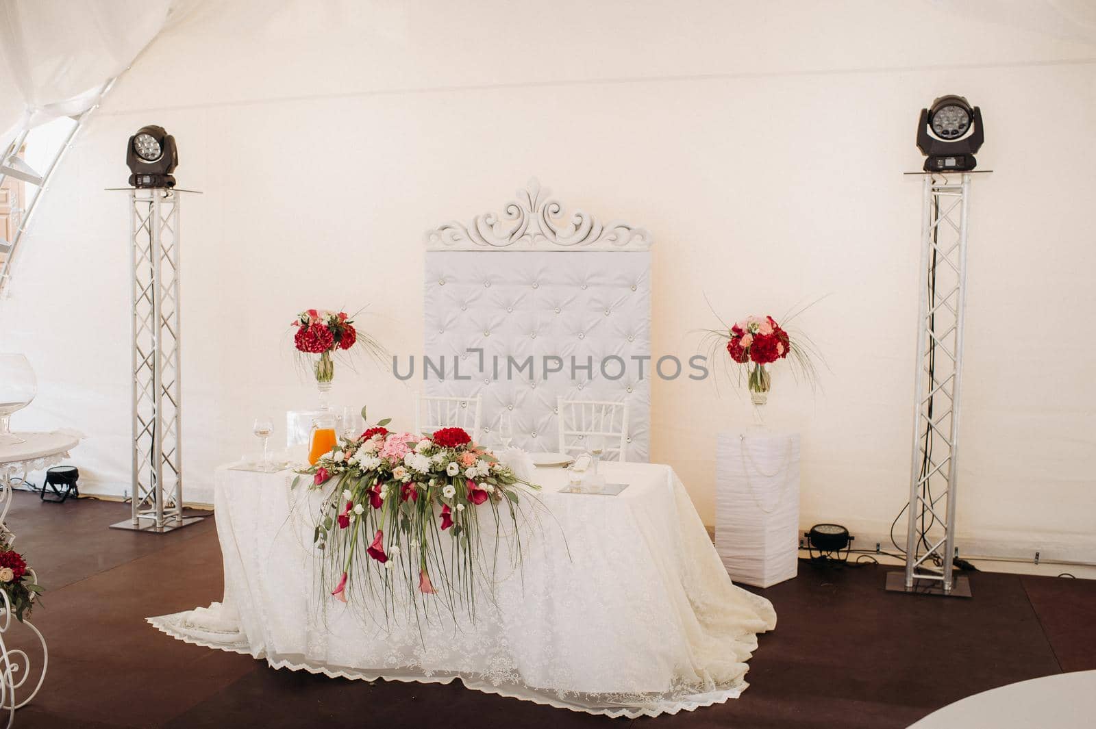 wedding table decoration with flowers on the table in the castle, table decor for dinner by candlelight.Dinner with candles.