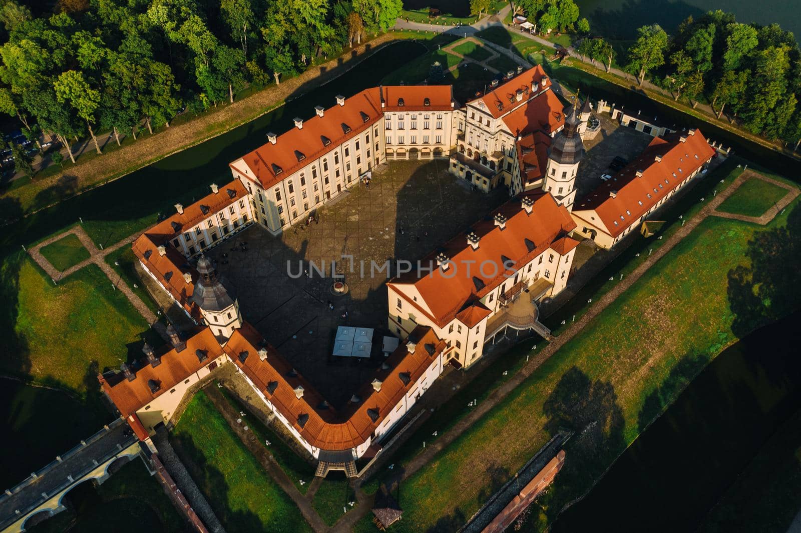 Aerial photo Nesvizh castle in autumn evening, Belarus Minsk, top view.