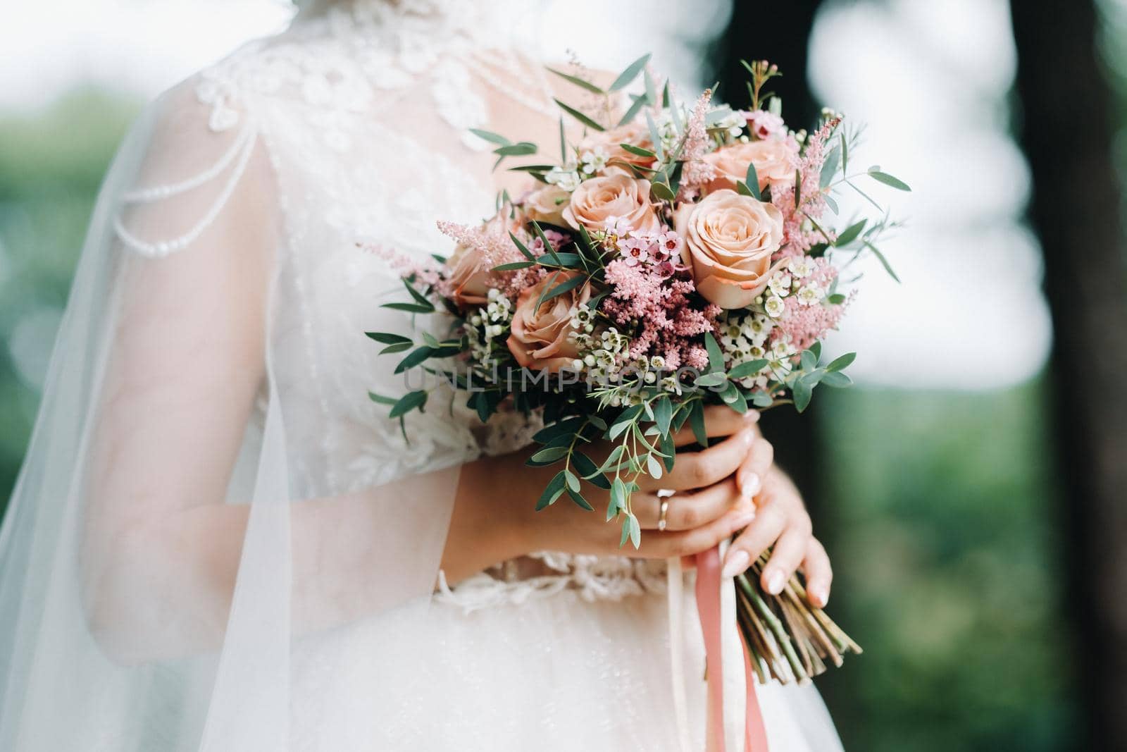 wedding bouquet in the hands of the bride.The decor at the wedding.