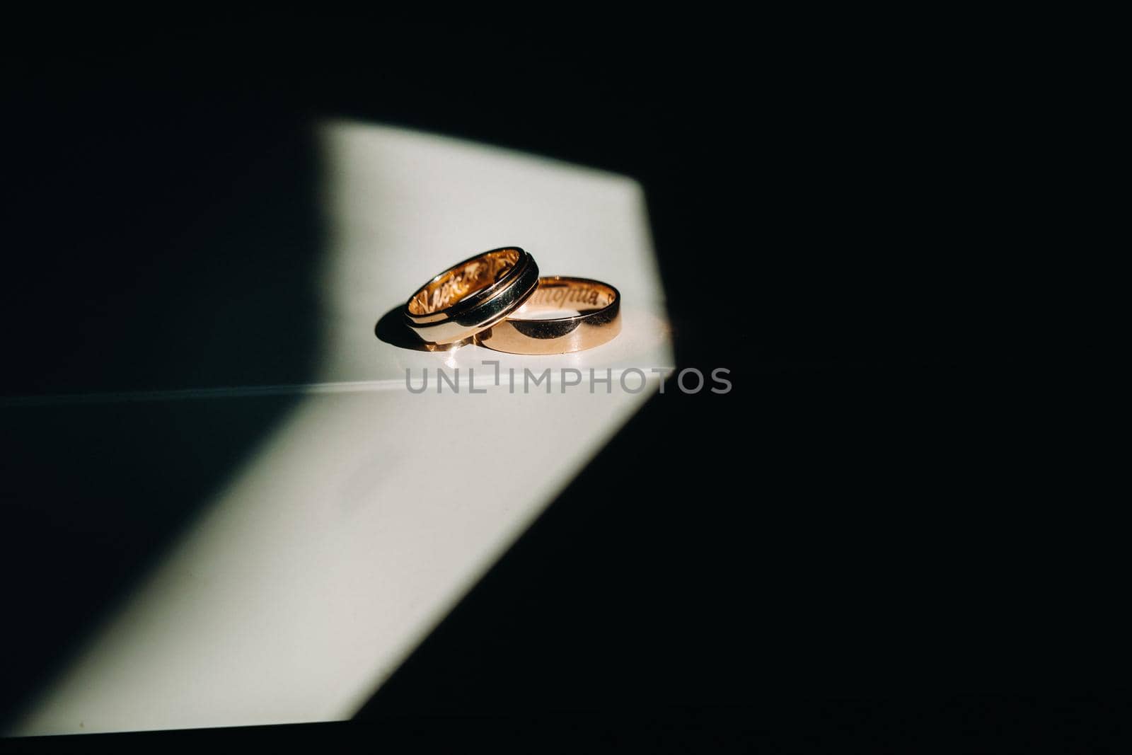 Close-up of two gold wedding rings for a wedding.