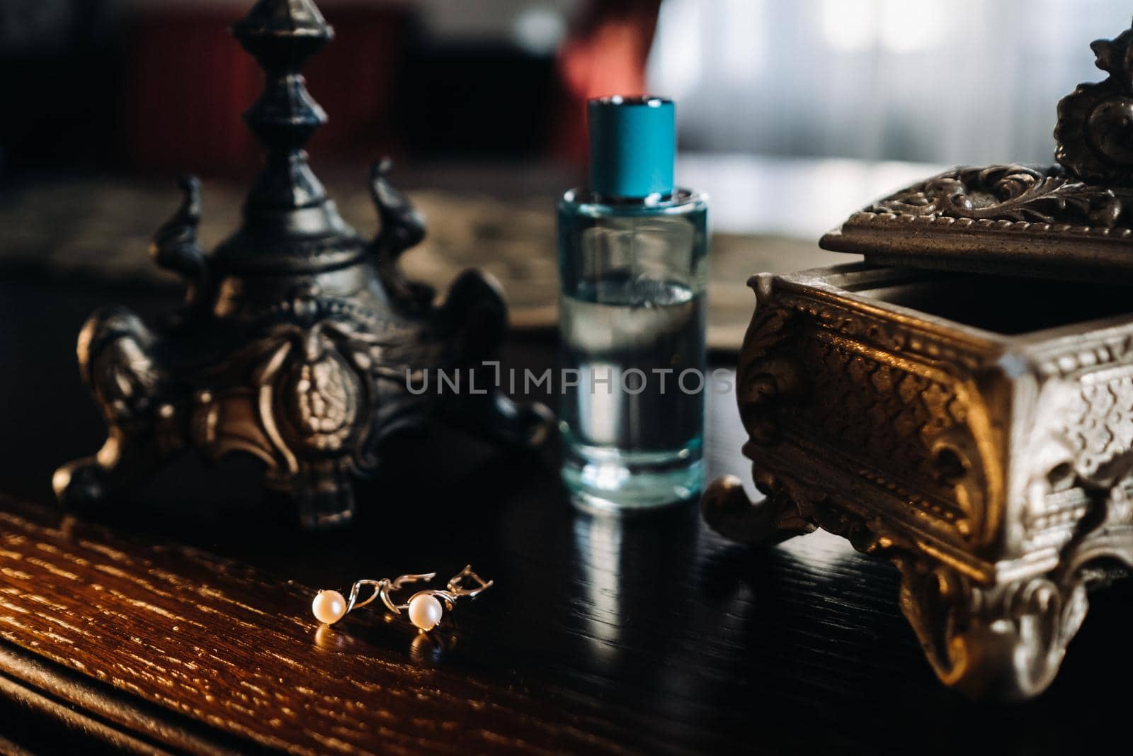 Accessories for the bride. Earrings on the table. White wedding earrings.