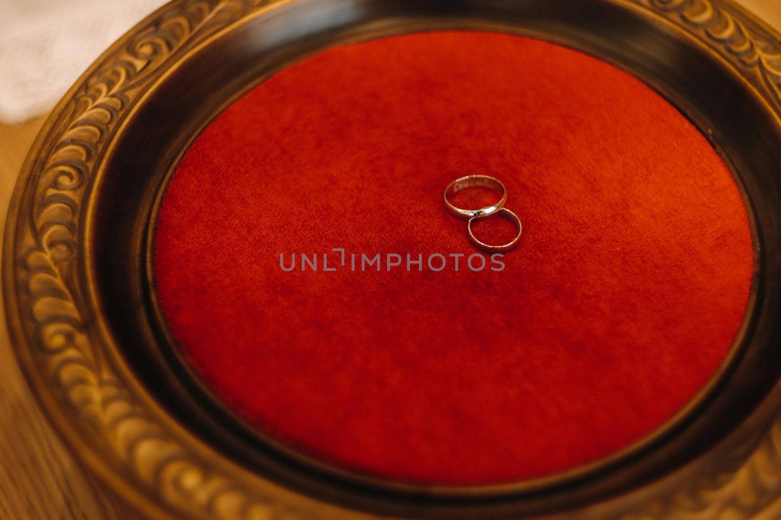 Close-up of two gold wedding rings for a wedding by Lobachad