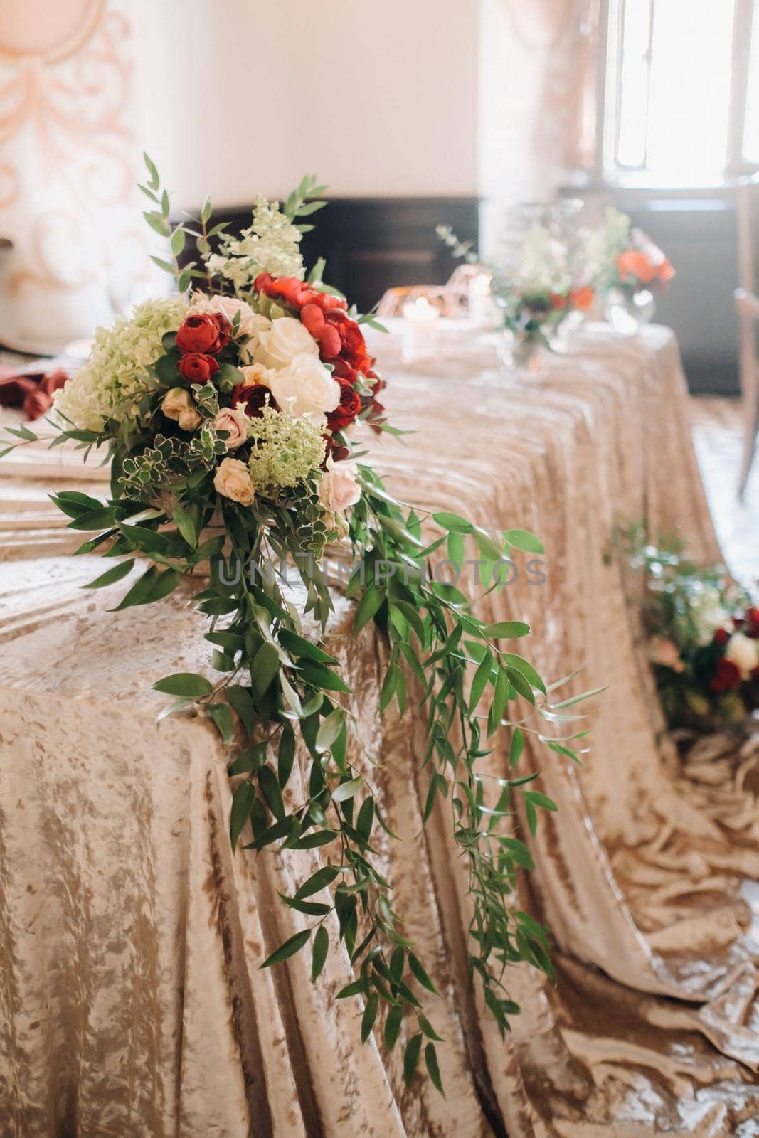 wedding table decoration with flowers on the table in the castle, table decor for dinner by candlelight.Dinner with candles.