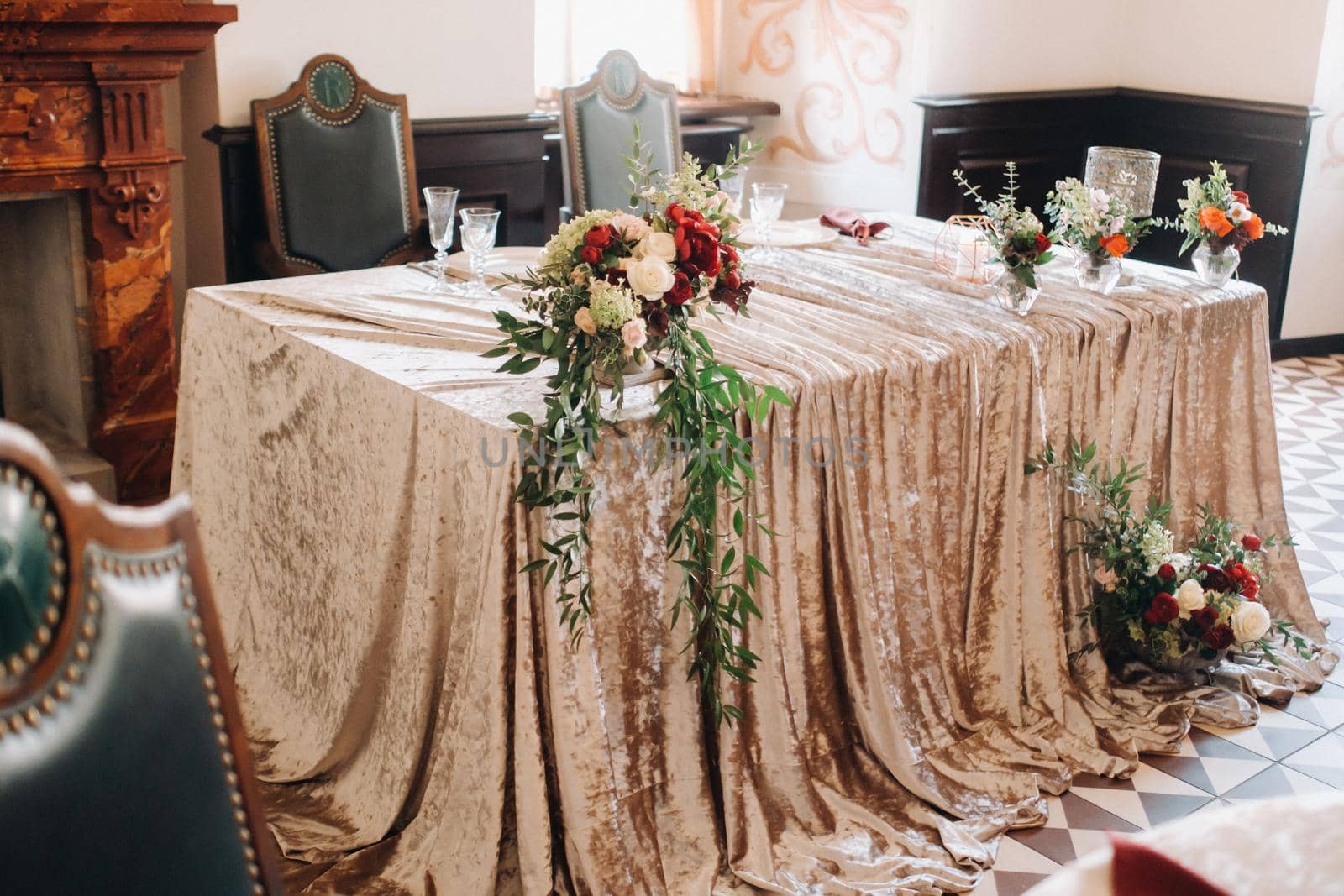 wedding table decoration with flowers on the table in the castle, table decor for dinner by candlelight.Dinner with candles.