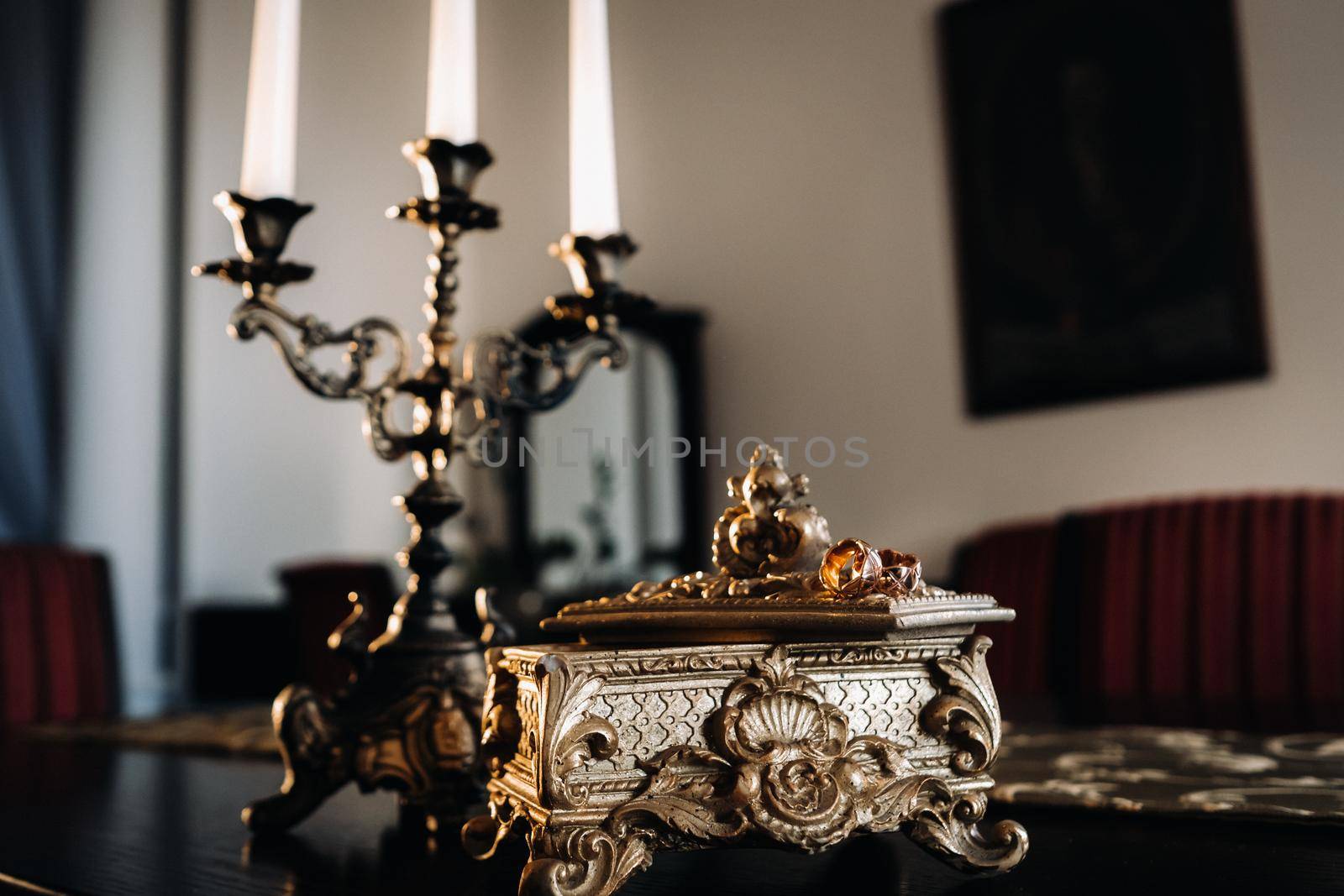 Gold wedding rings lie on an antique jewelry box. Wedding rings for ceremonies.