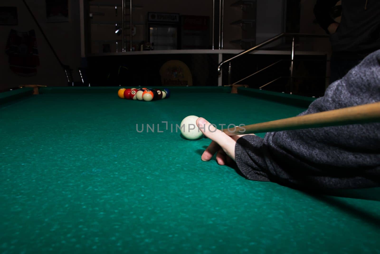 Billiard balls on a green table close up