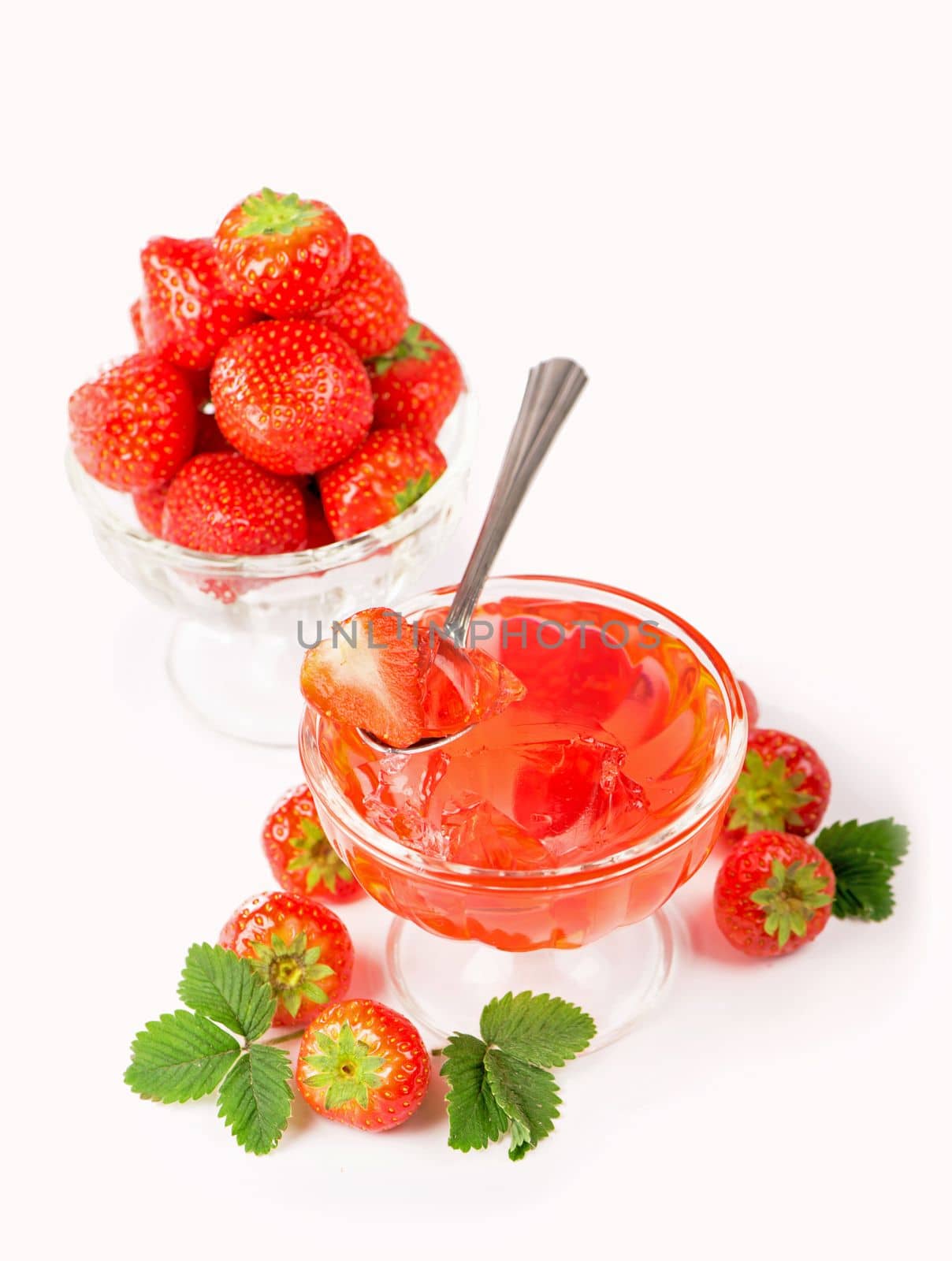 Cream bowl, bowl with fresh strawberries and sweet strawberry jelly against white background by aprilphoto