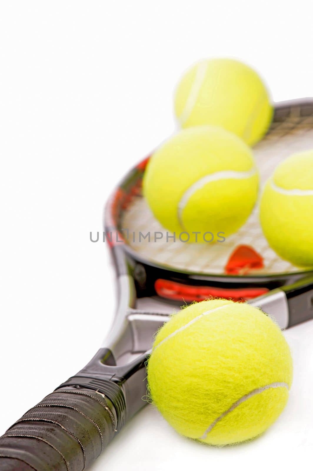 Yellow tennis balls and tennis racket isolated on a white background