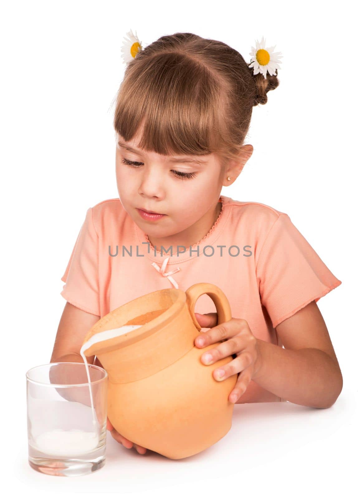 girl pours milk from a jug on a white background by aprilphoto