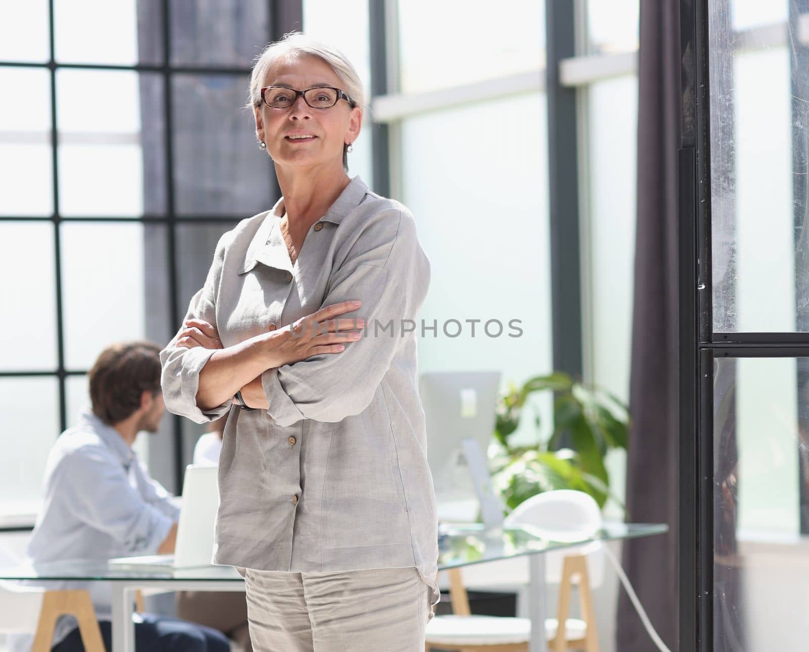 mature woman closeup hands together in the office.