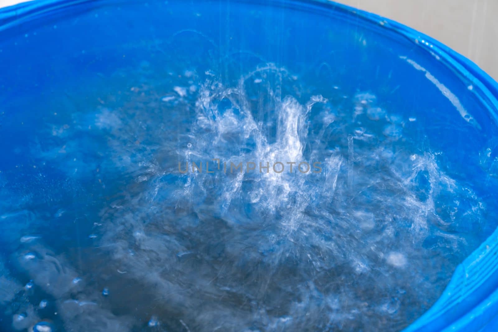 rainwater in a barrel in front of the house.