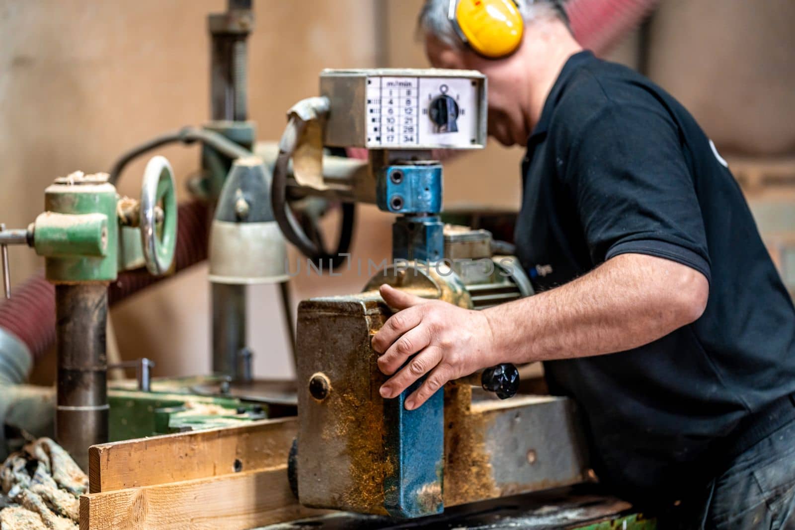 replacement of knives on a milling machine in a joinery. High quality photo
