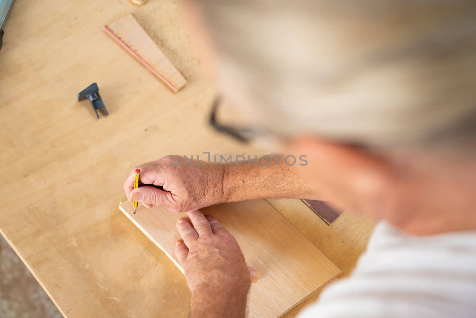 Unknown unrecognizable carpenter working in manual and craft work with copy space for text. High quality photo
