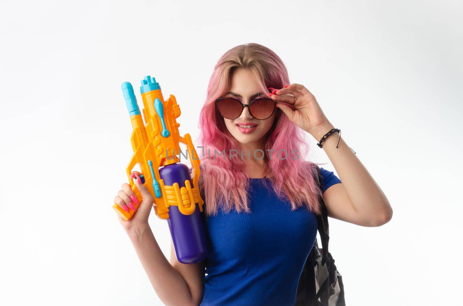 a girl with a water gun in summer clothes, slim and sexy, isolated on a white background drinking coffee