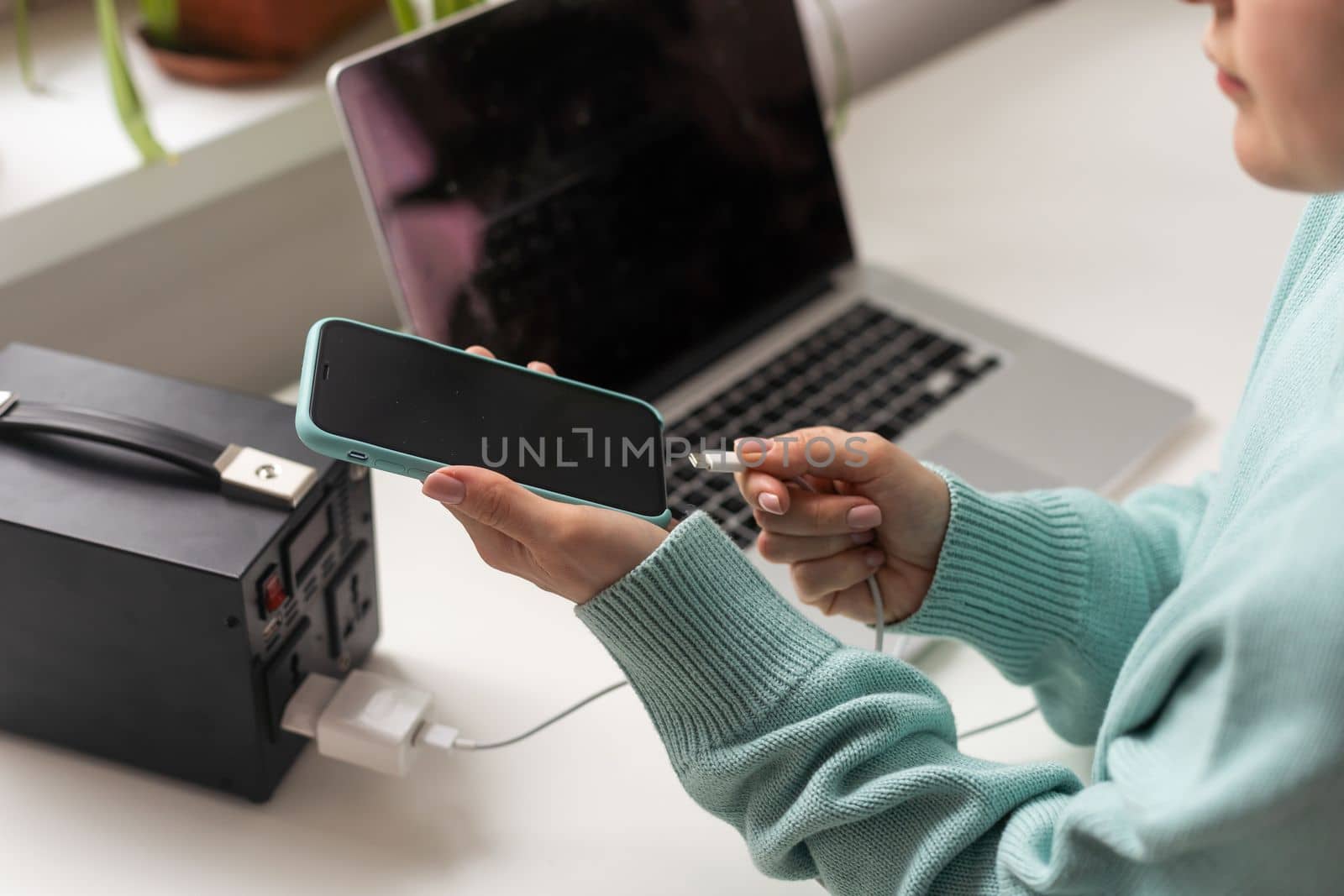 Charging station for phone, tablet, laptop and other gadgets when there is no light during blackout. Generator power bank battery in the absence of electricity. Charge electric rechargeable battery