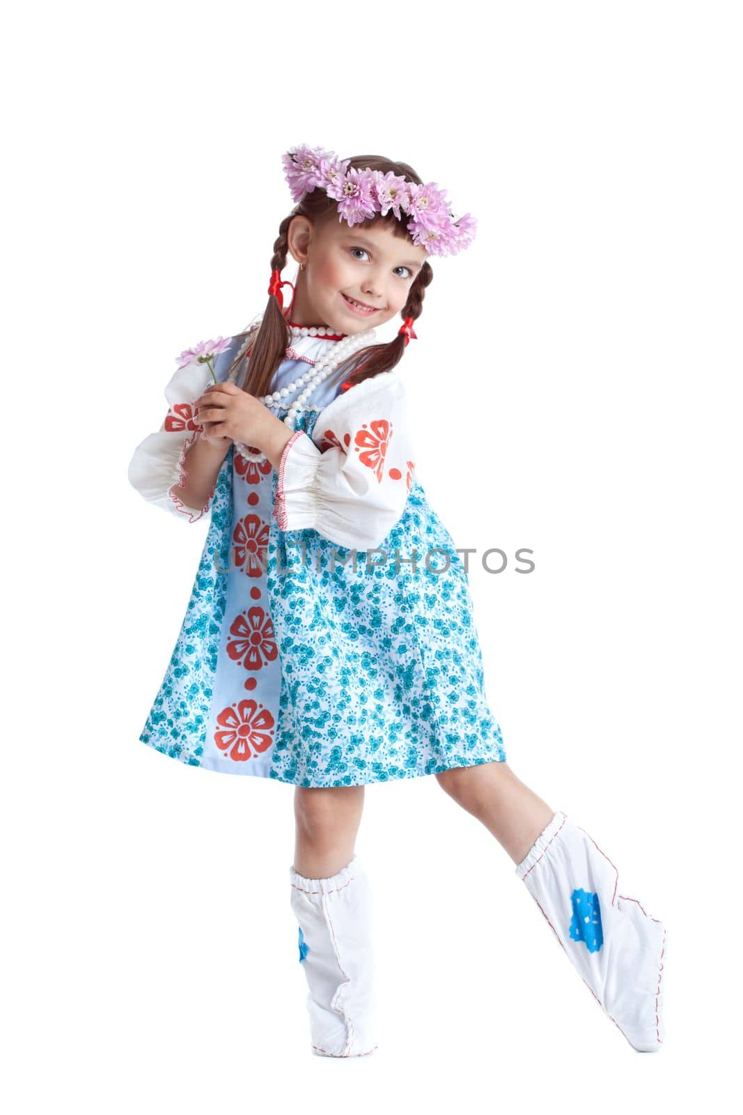 portrait of beautiful little girl in slavic costume and wreath of flowers. Isolated on white
