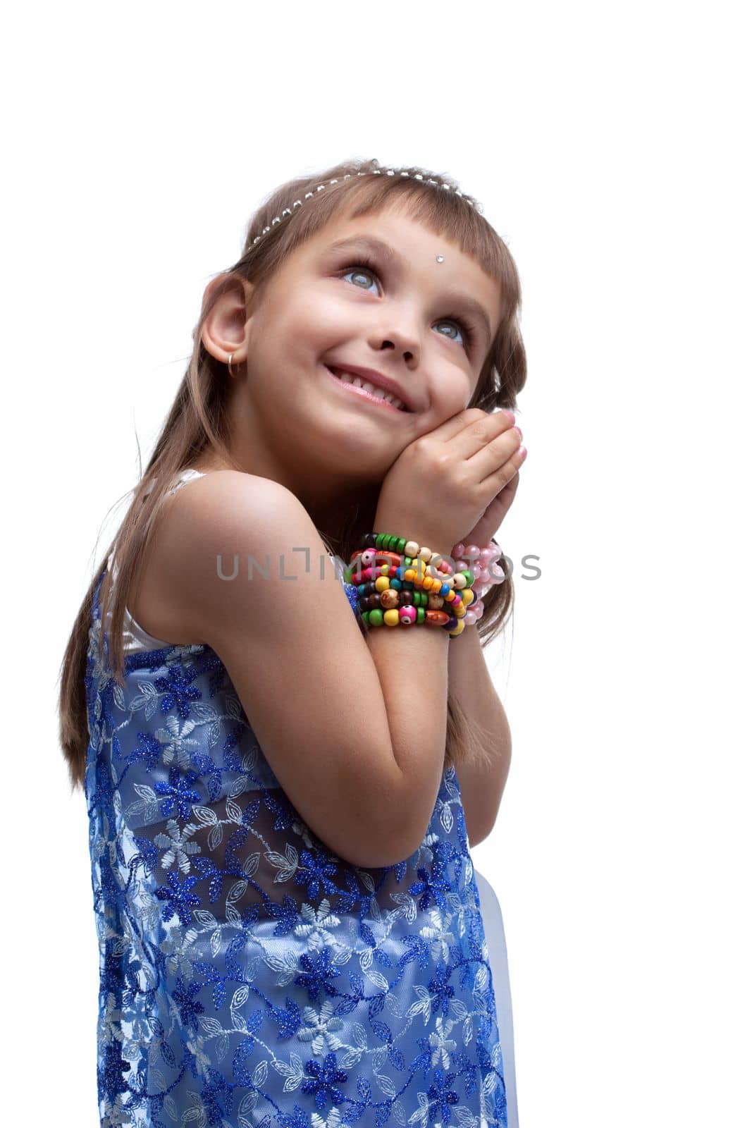 Happy little girl in indian costume in dream isolated on white