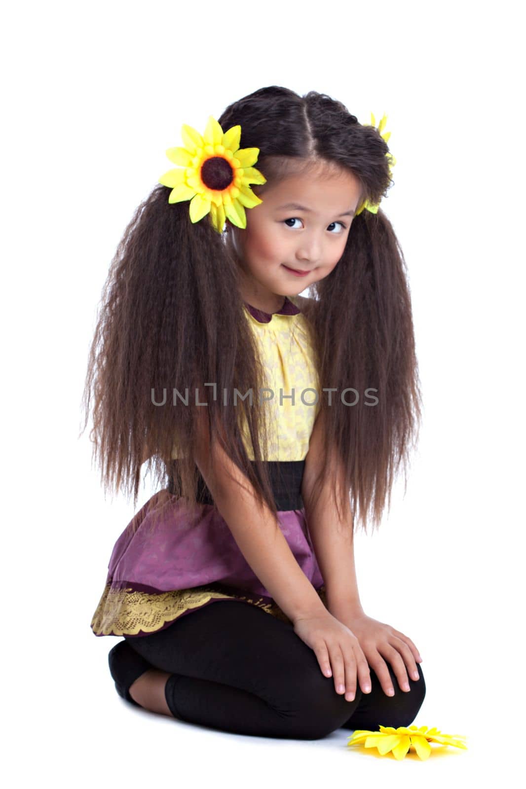 Full length portrait of fashion asian little girl with sunflowers in head. Isolated on white