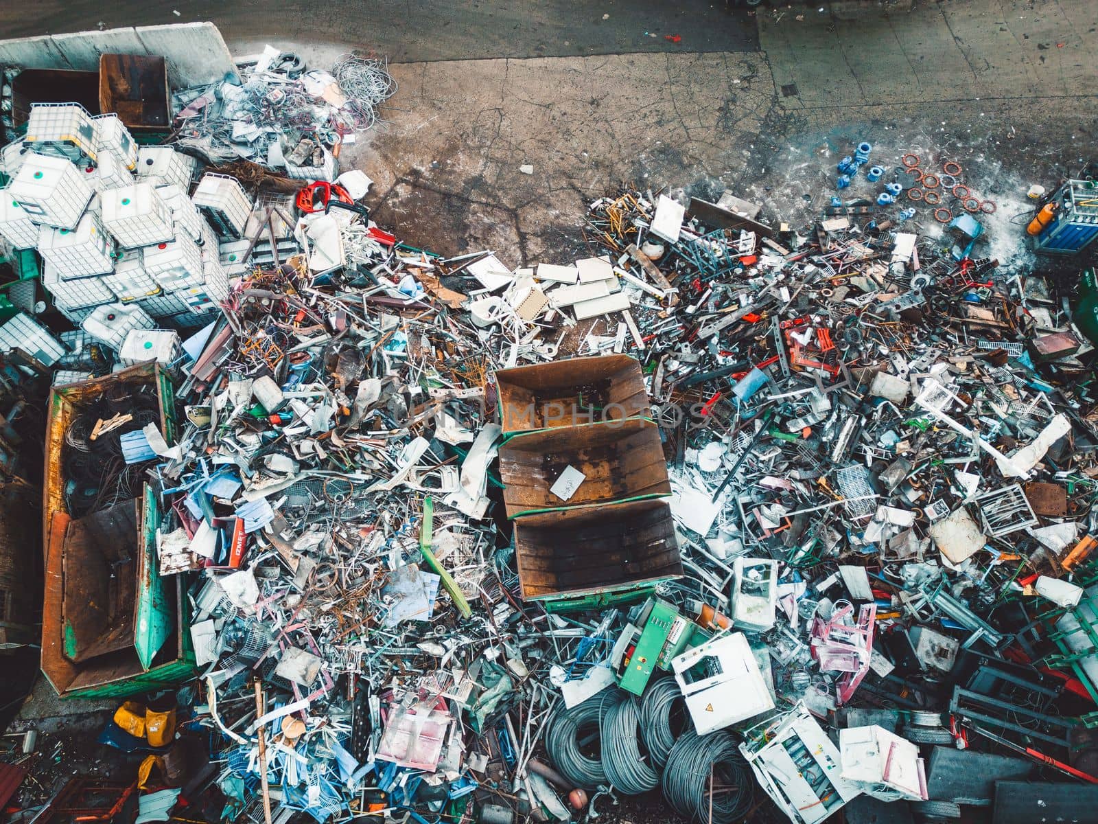 Aerial view of huge pile of garbage at the recycling center by VisualProductions