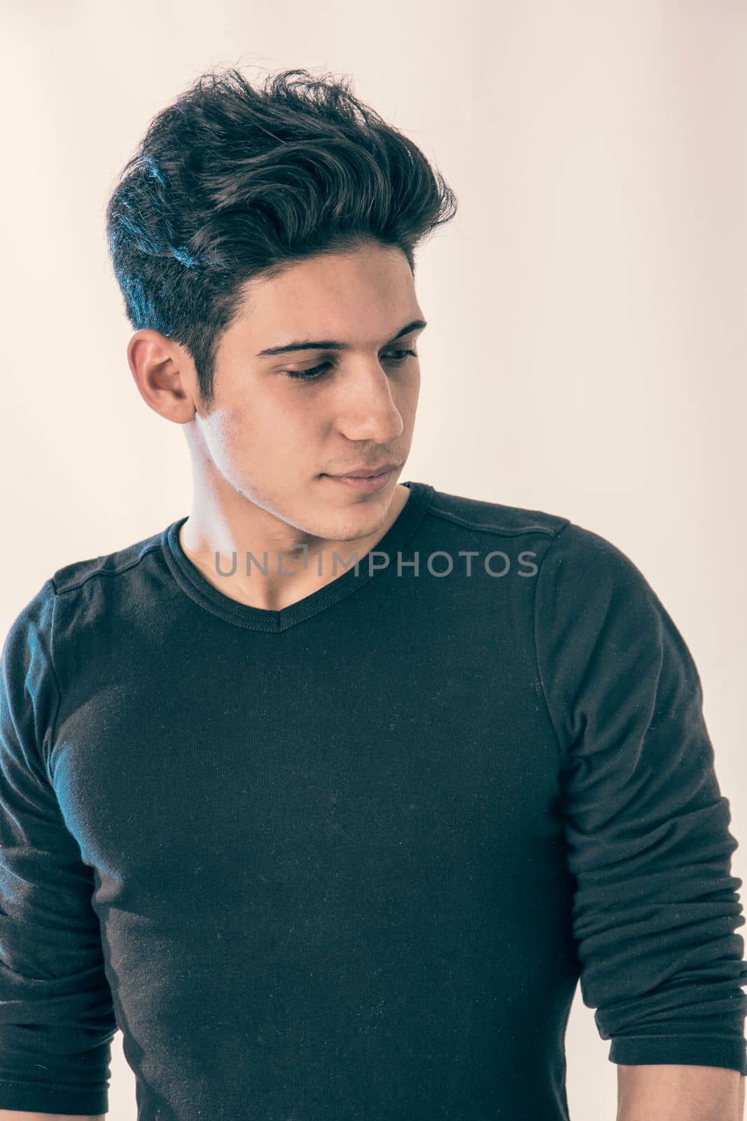 Handsome and fit young man standing on white background by artofphoto