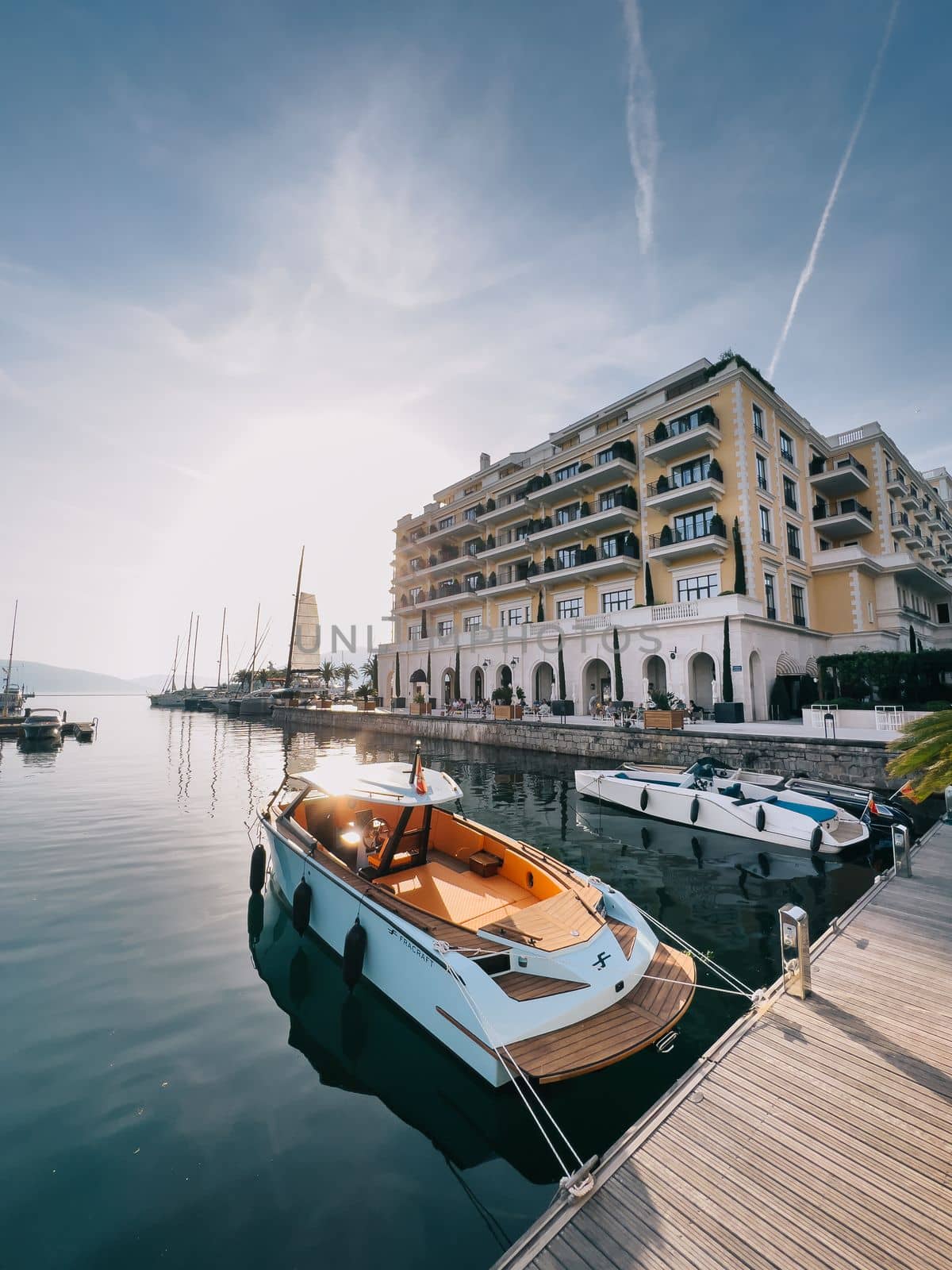 Yachts are moored at the pier of the Regent Hotel in Porto. Montenegro. High quality photo