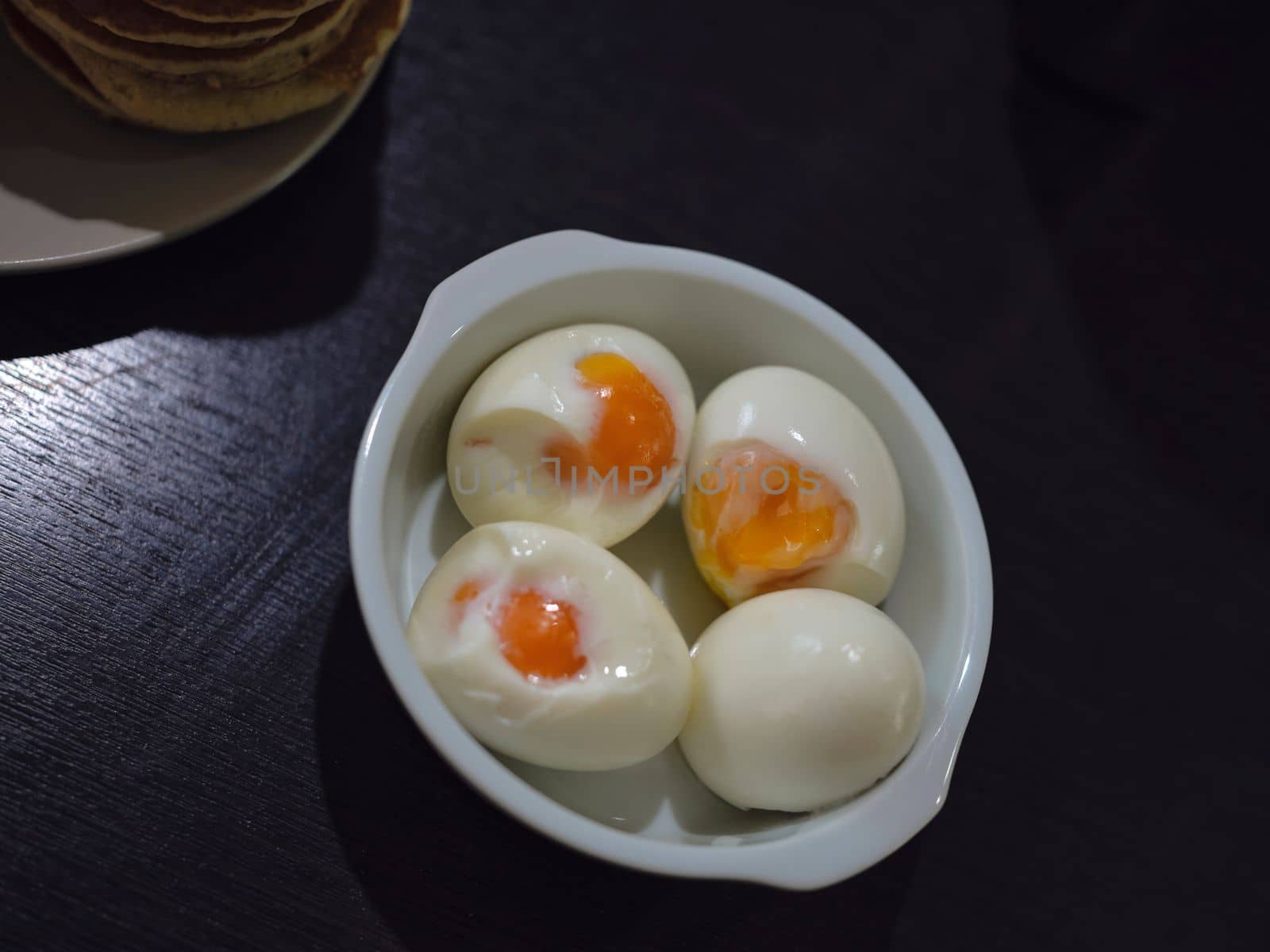 Fresh hard boiled chicken eggs on bowl by Hepjam