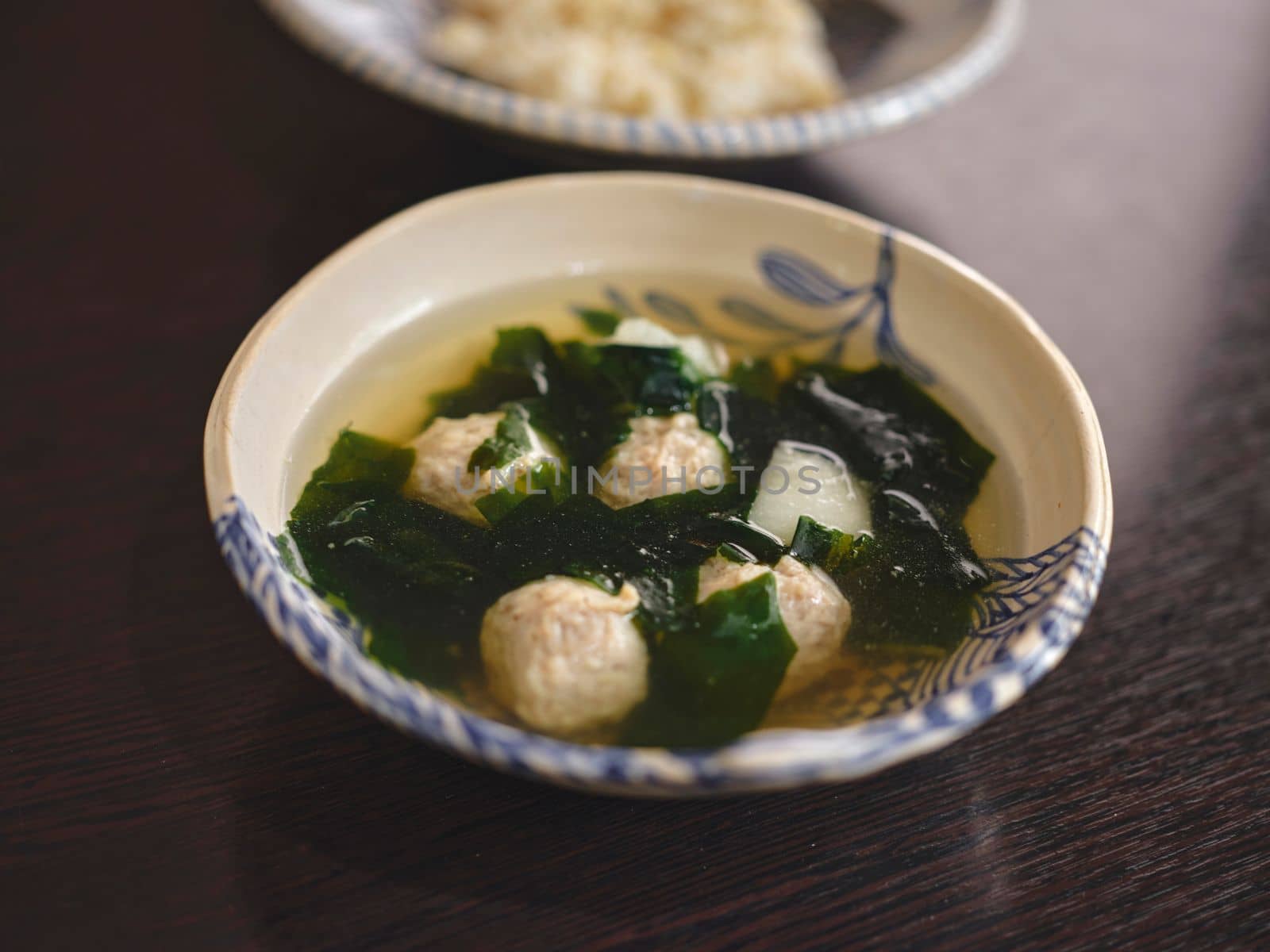 Clear soup with seaweed and minced pork . THAI food