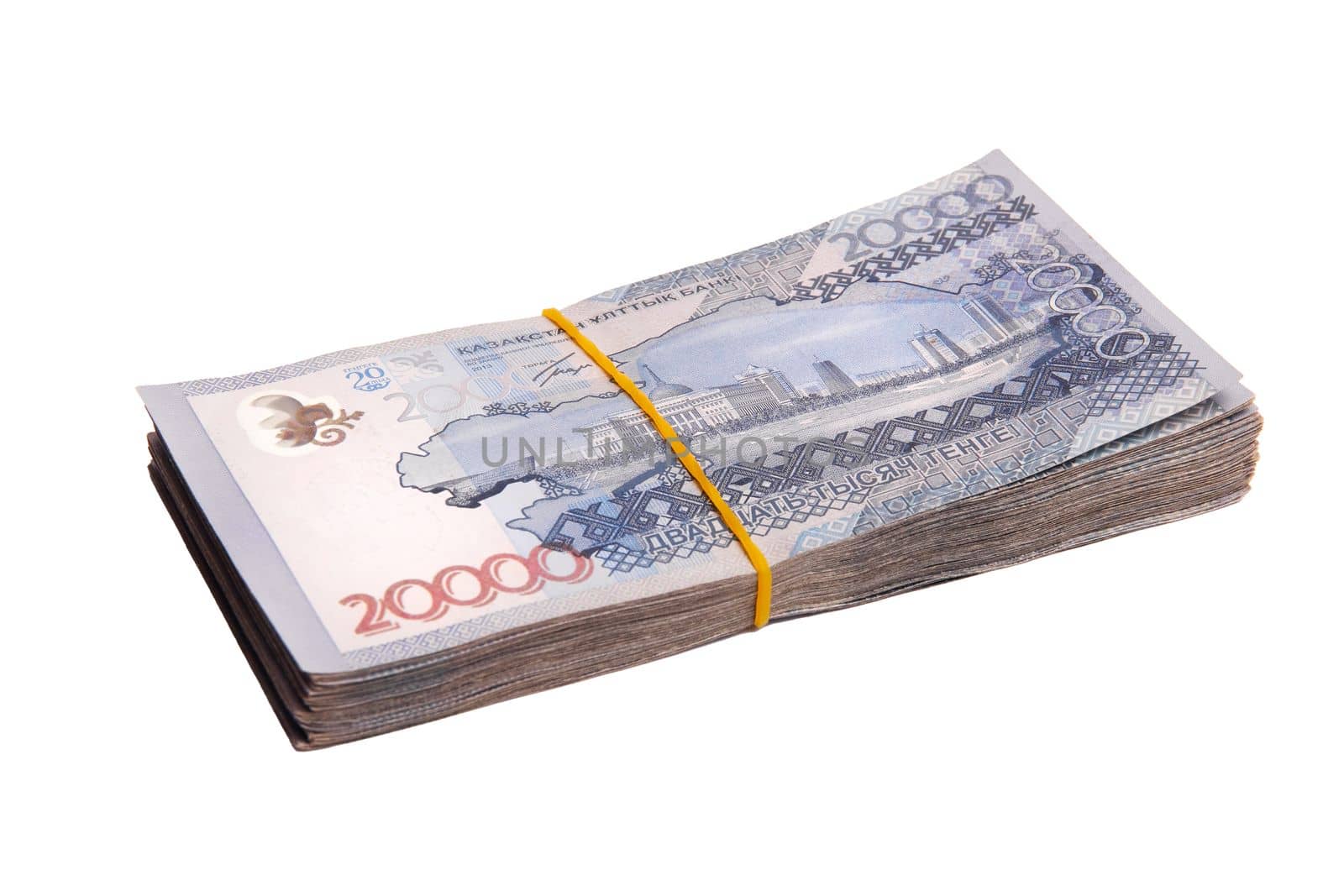 Bundle of Kazakhstan banknotes of 20000 tenge tied with an elastic band, isolated on white.