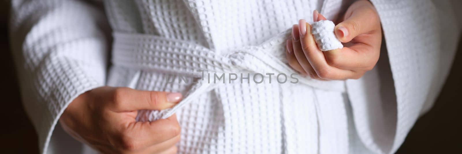 Woman bathrobe after shower in white clean bathrobe by kuprevich