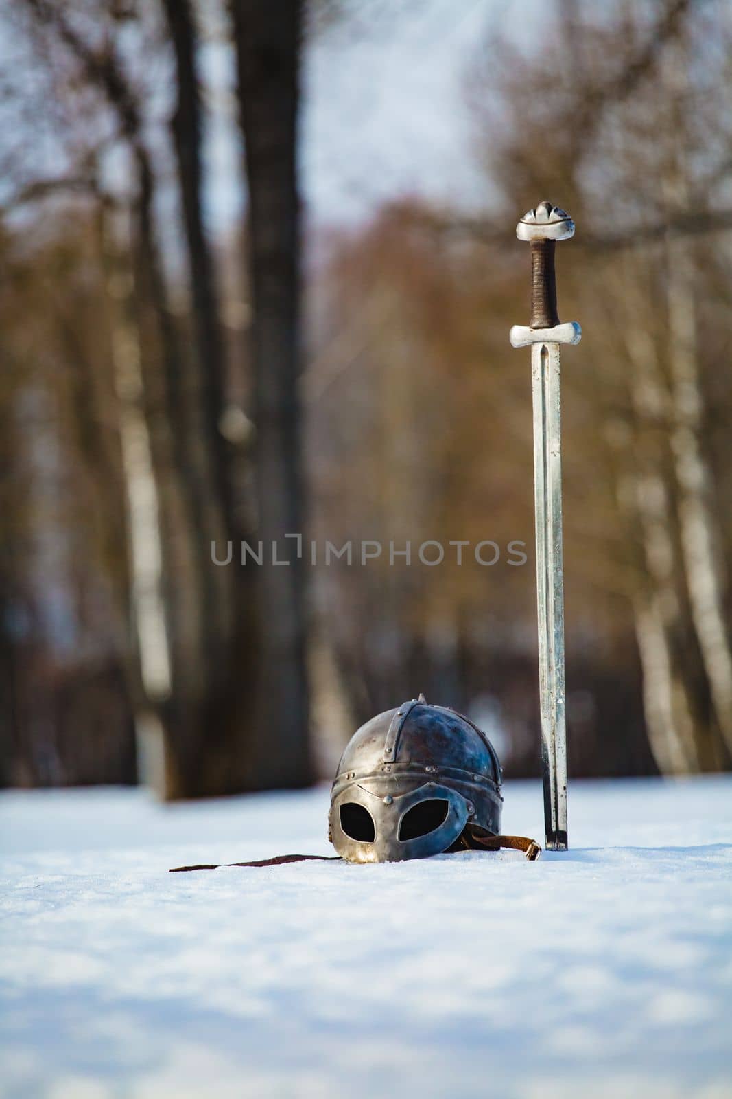Image of silver sword and helmet fantasy medieval period by Gennadii_Chebeliaev