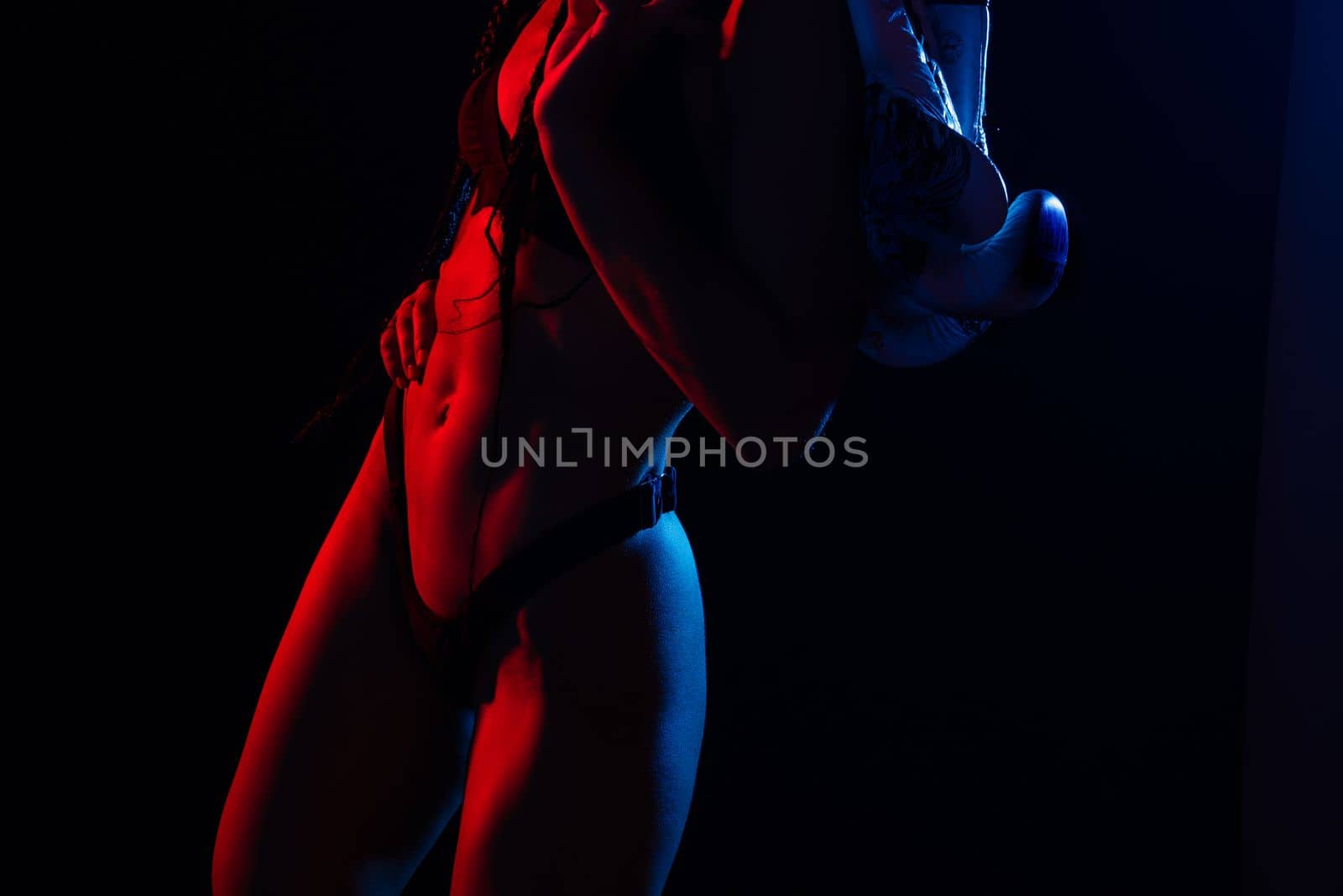 Close-up shot of young woman waist with muscular abdominal muscles. Abs of fit female athlete. by Zelenin