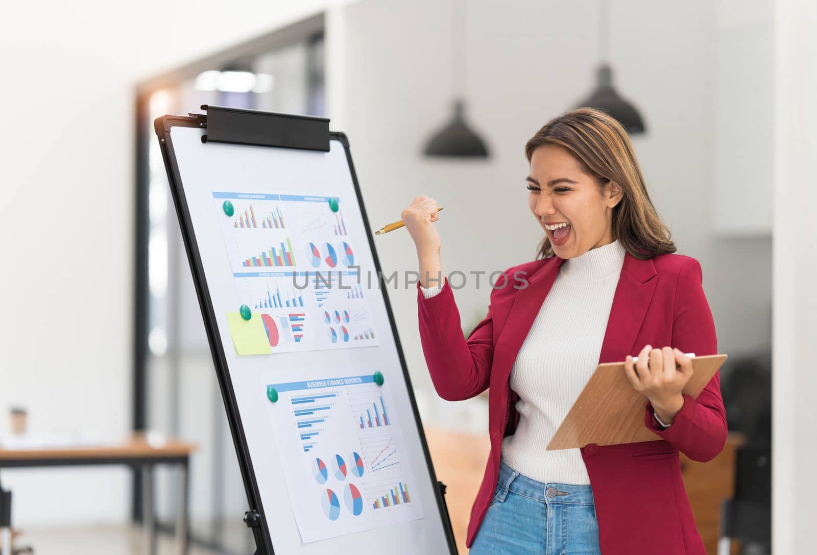 Portrait young businesswoman presentation marketing and profit with confident at office, investment and seminar for planning of finance, business woman standing explaining chart and graph...