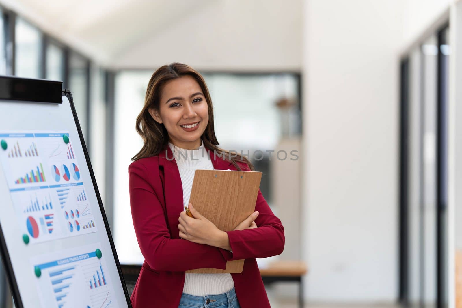 Portrait young businesswoman presentation marketing and profit with confident at office, investment and seminar for planning of finance, business woman standing explaining chart and graph...