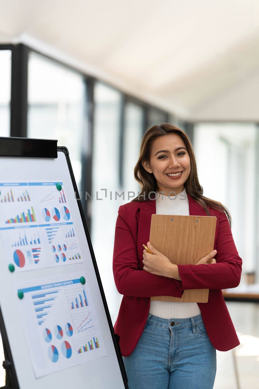 Portrait young businesswoman presentation marketing and profit with confident at office, investment and seminar for planning of finance, business woman standing explaining chart and graph...