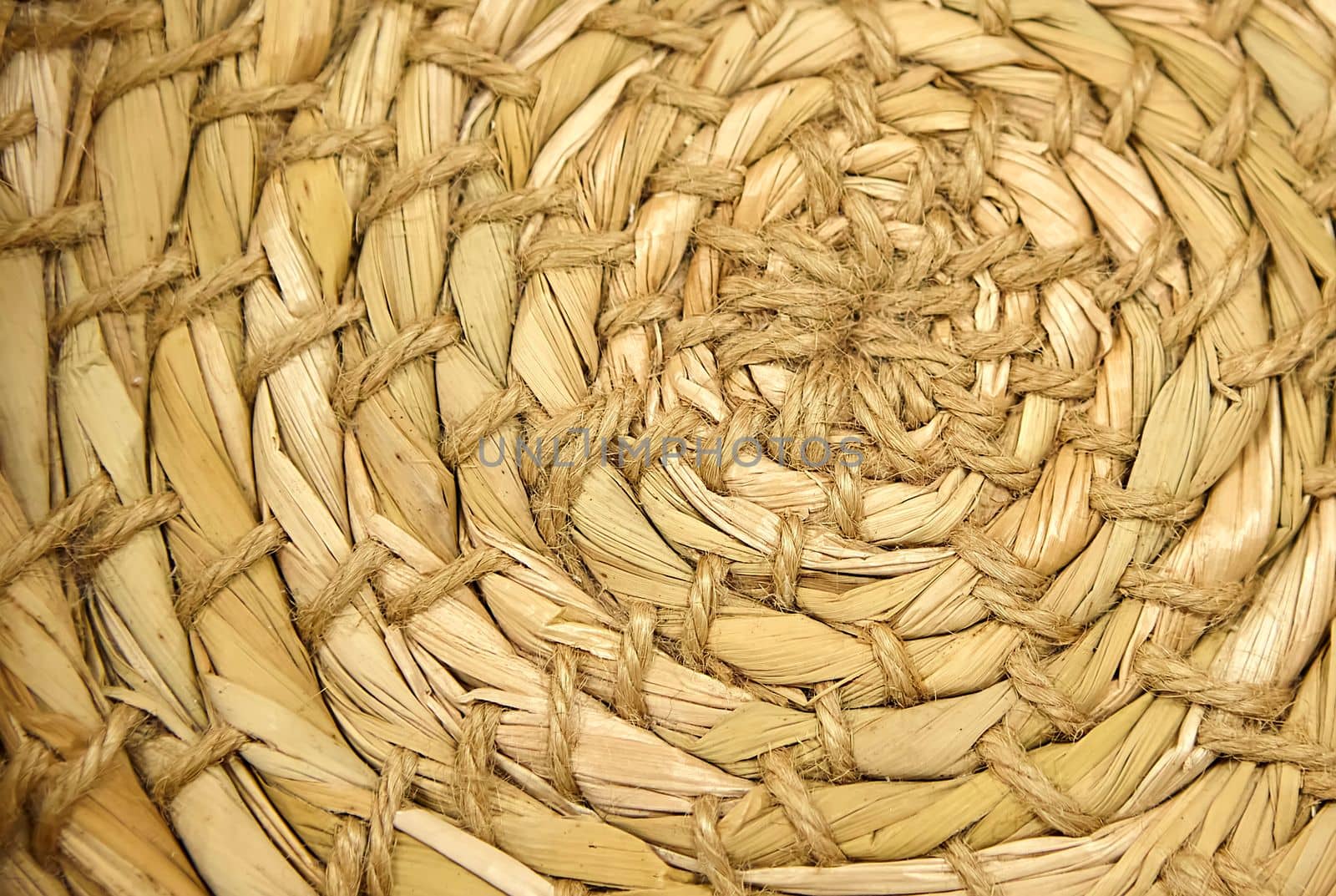 Close-up of Esparto round grass rug, natural fiber background. Weaving from grass and straw, handmade, circle.