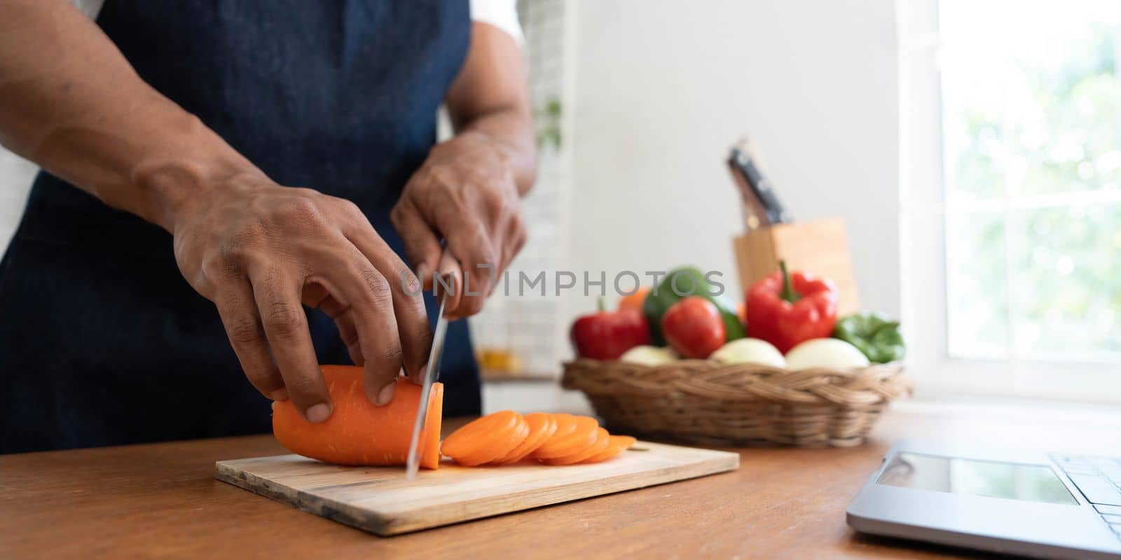 Closeup portrait of asian man making salad at home. cooking food and Lifestyle moment by wichayada