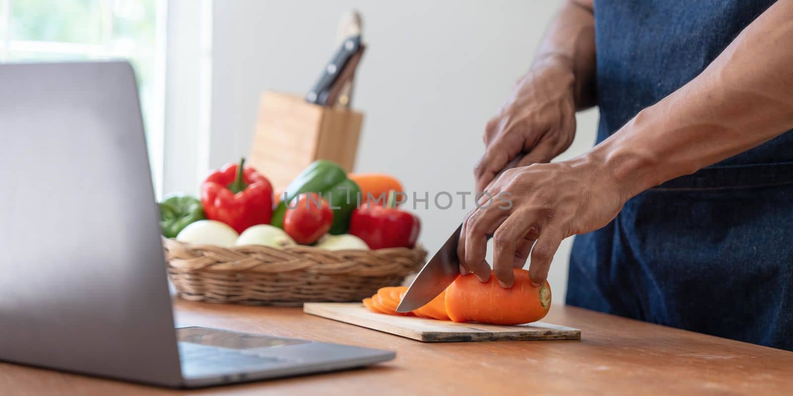 Closeup portrait of asian man making salad at home. cooking food and Lifestyle moment by wichayada