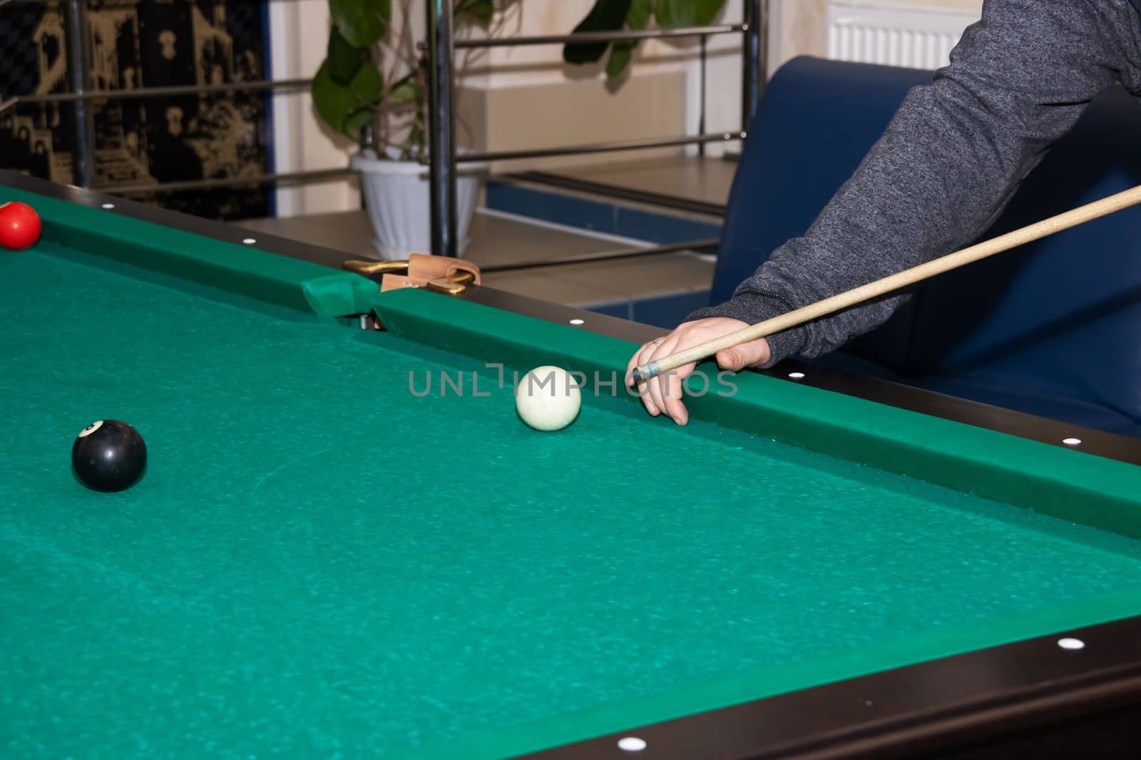 Billiard balls on a green table close up