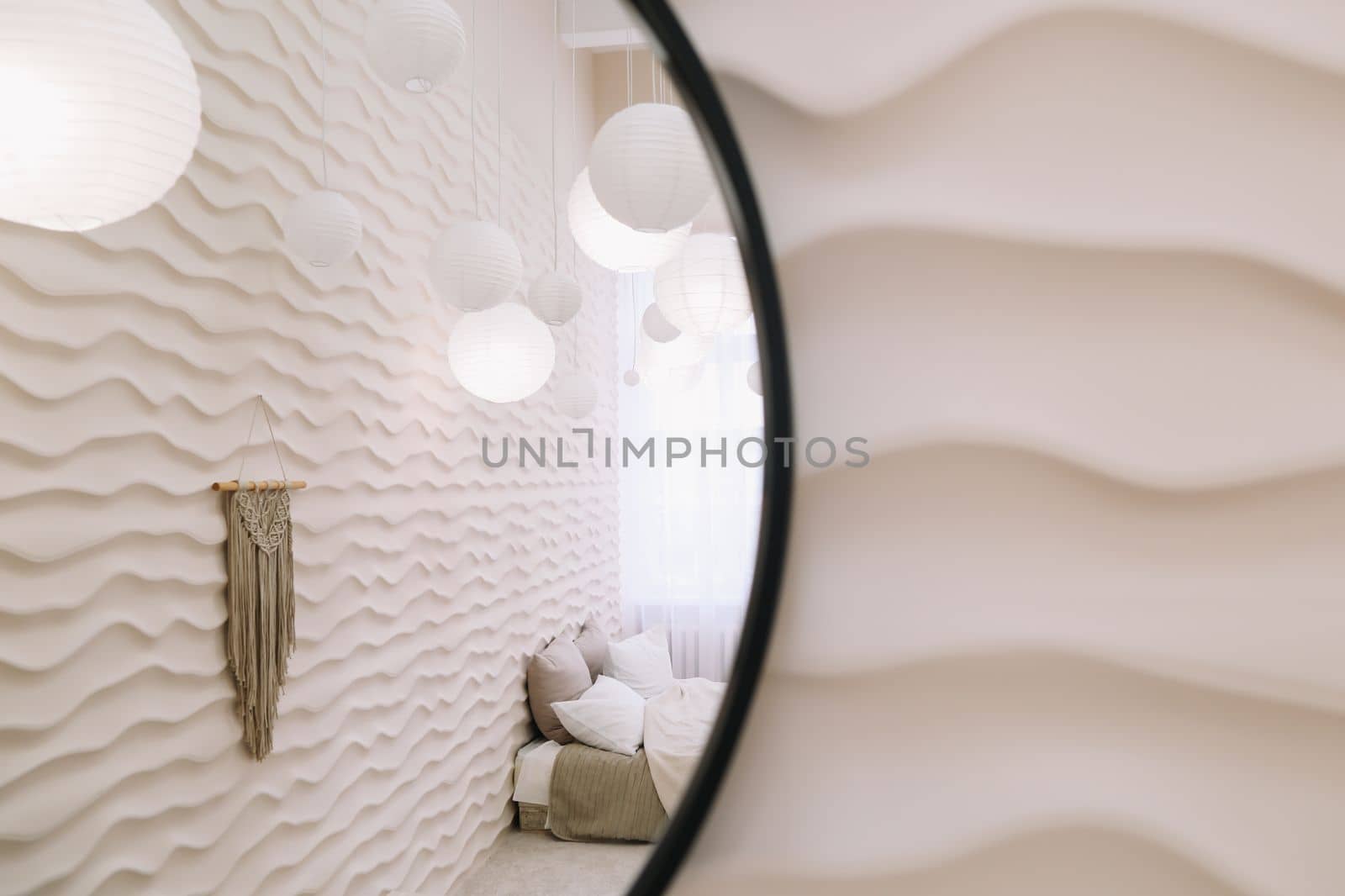 White bedroom interior. Stylish interior of contemporary room with comfortable bed.
