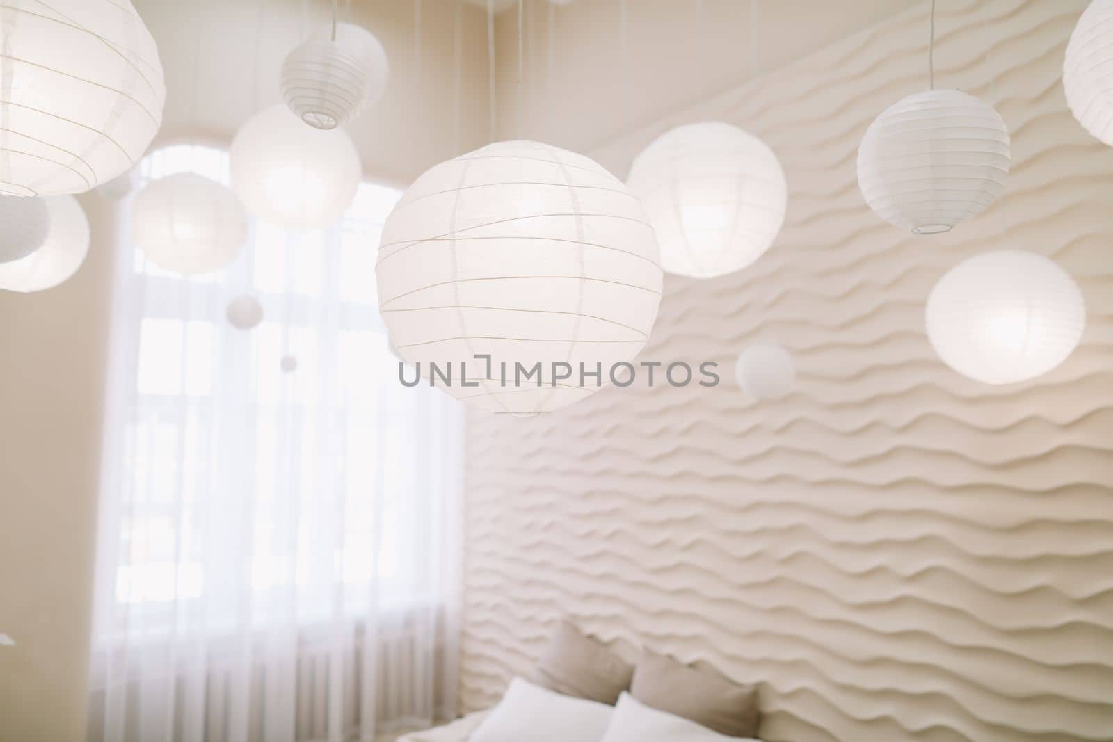 White bedroom interior. Stylish interior of contemporary room with comfortable bed.