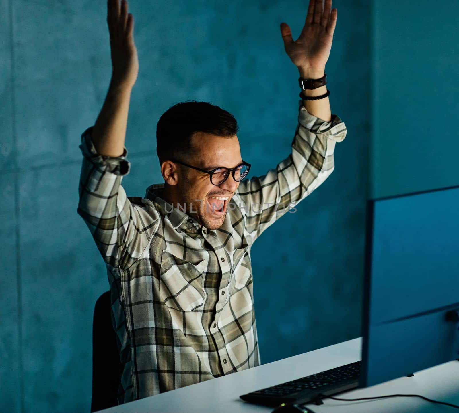 businessman working late night business computer man office technology light dark happ success celebrate victory deadline work by Picsfive