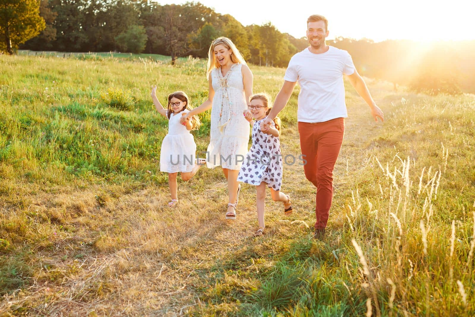 Portrait of a young happy family having fun outdoors