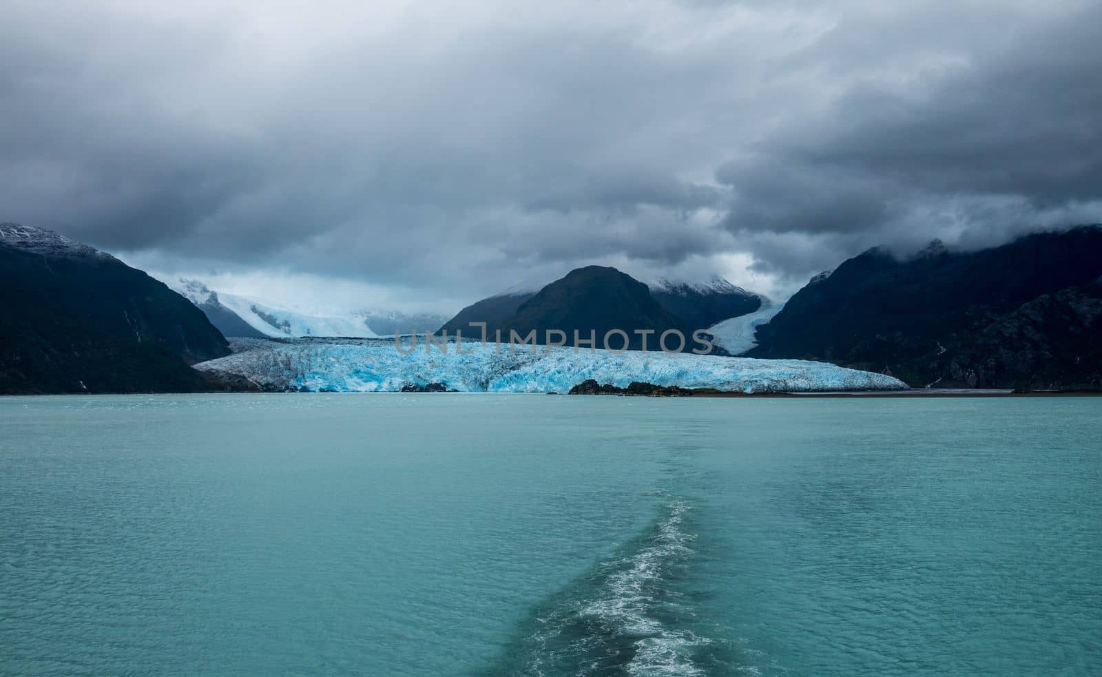 Panorama of Amalia glacier with detail of the fissures and rocks in its path