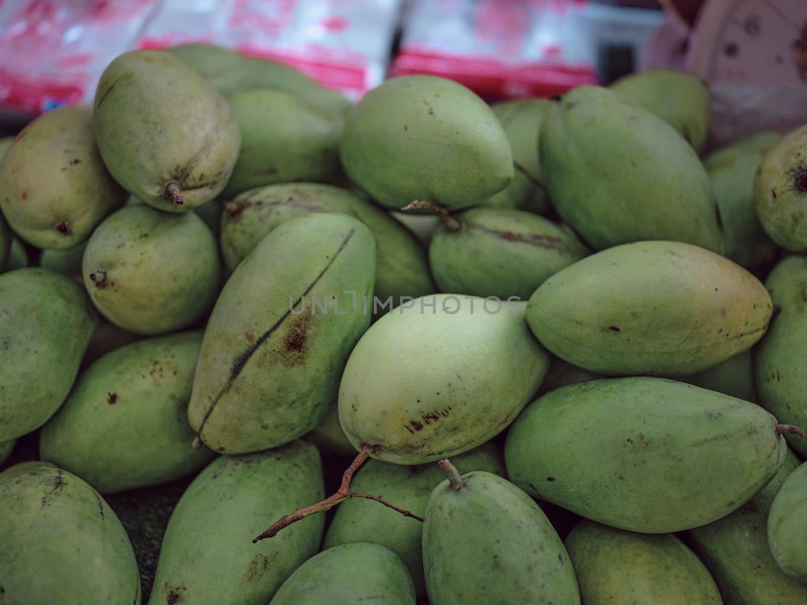 Green mangoes on  Thai market . by Hepjam