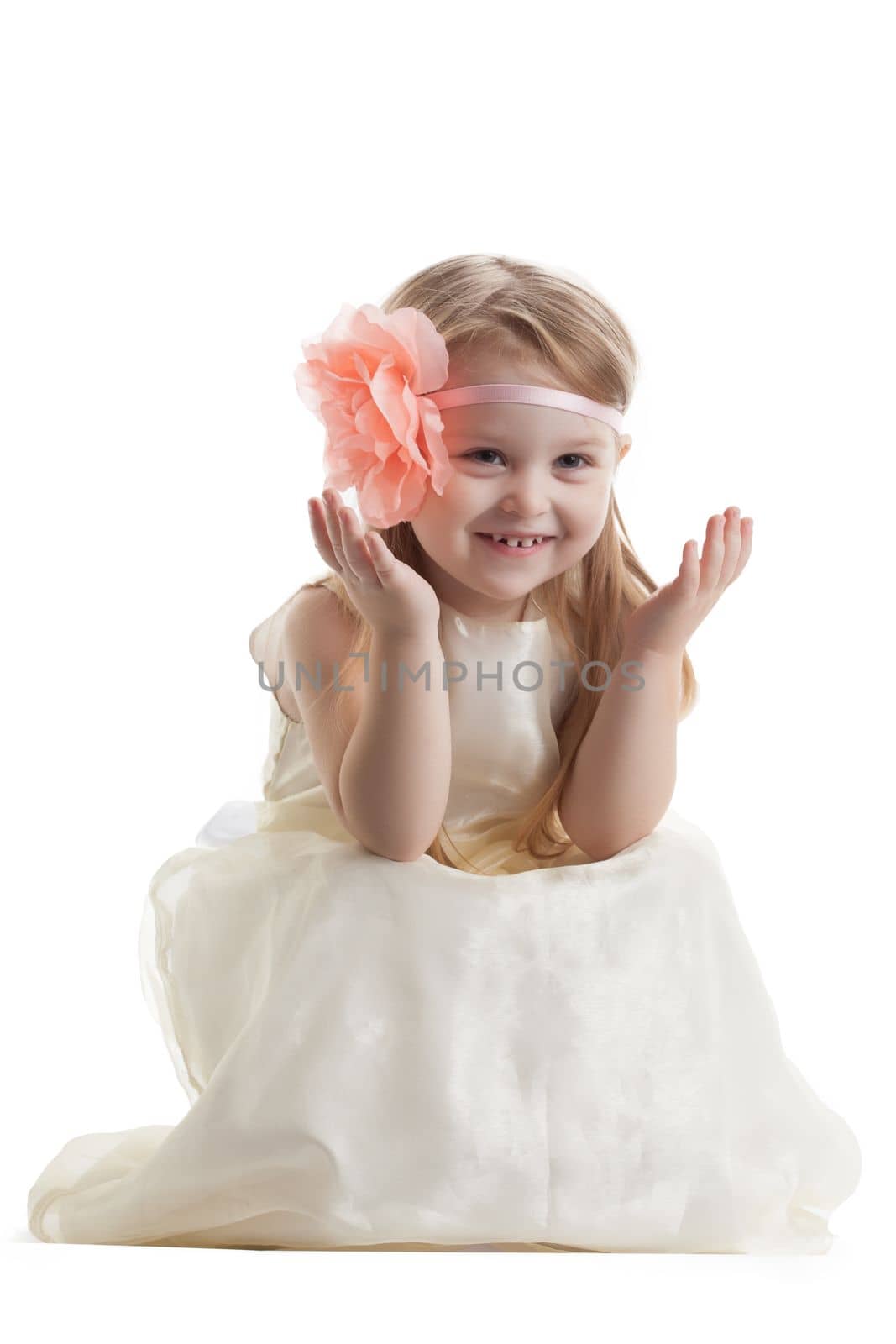 Funny little girl in long dress. Isolated on white