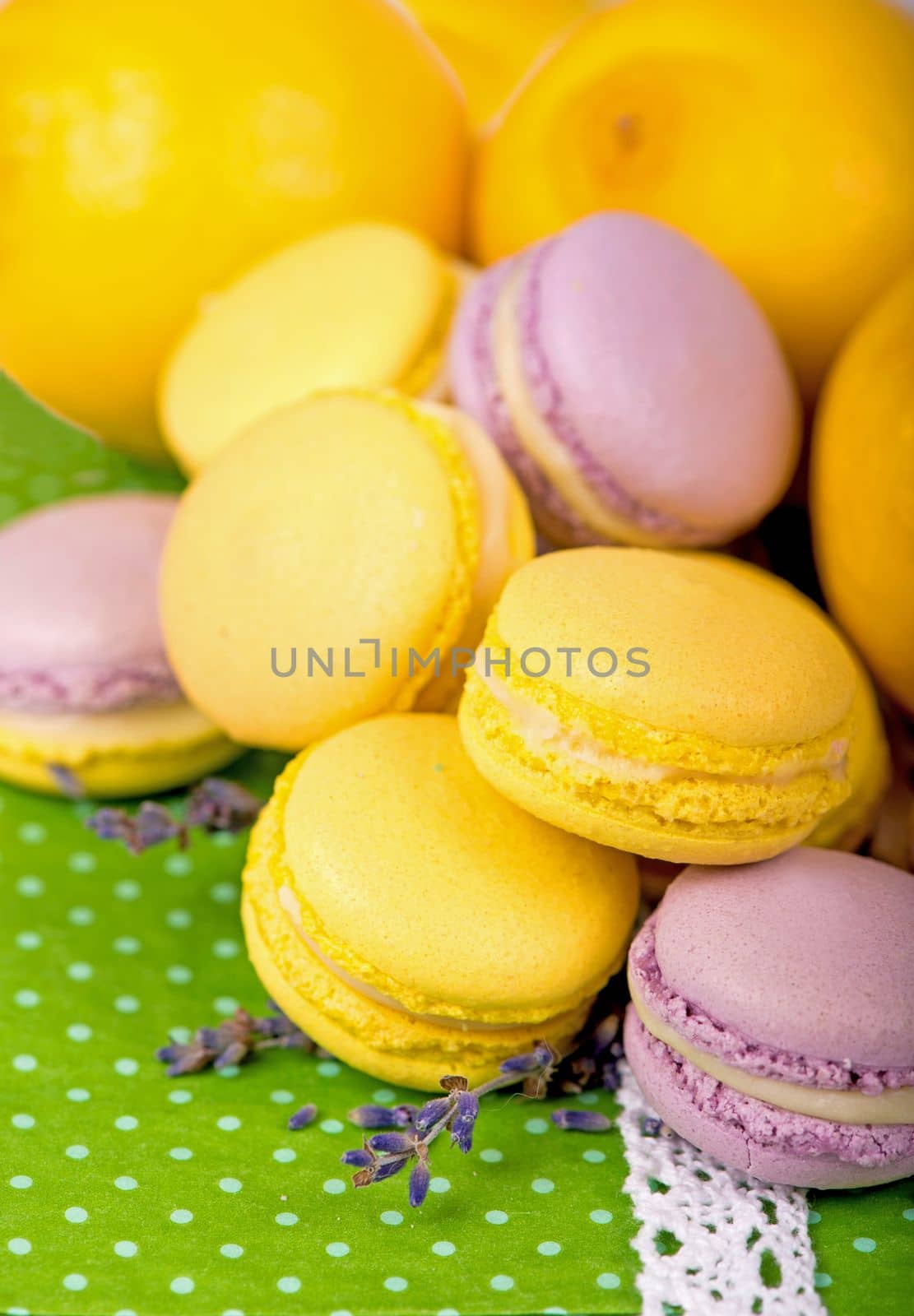 Sweet macaroons on a green napkin, vintage color tone by aprilphoto